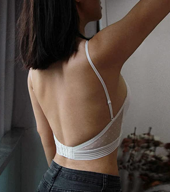 woman in a white low back bralette top